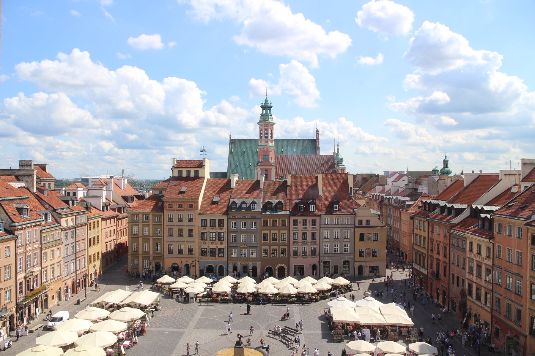 Colorful historic buildings surrounding Warsaw’s Old Town Market Square in Poland